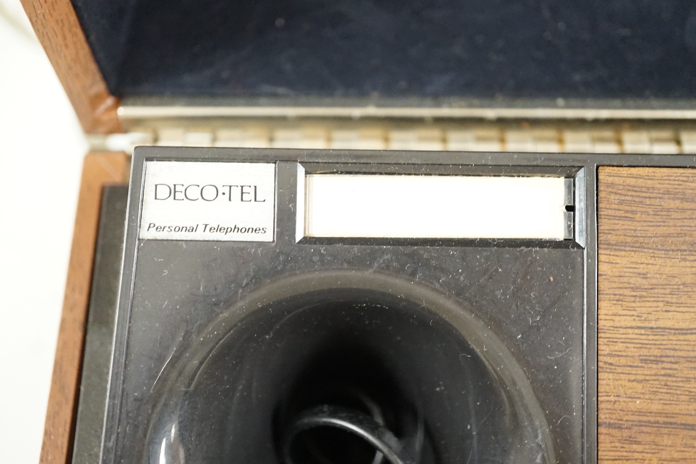A Deco-Tel personal telephone set in hinged case